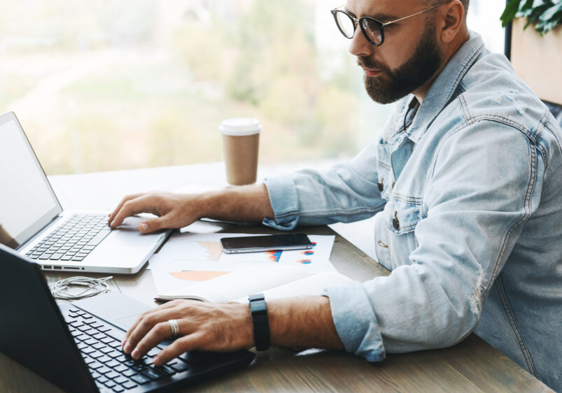 Side,View.,Hipster,Bearded,Businessman,Sits,In,Cafe,,Modern,Office,